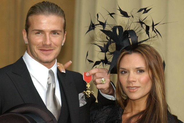 File photo dated 27/11/03 of David Beckham with his wife, Victoria, as he shows off the OBE (Officer of the Order of the British Empire) he received, from Queen Elizabeth II at Buckingham Palace, as he described receiving his OBE from the Queen with his grandparents in the audience as 