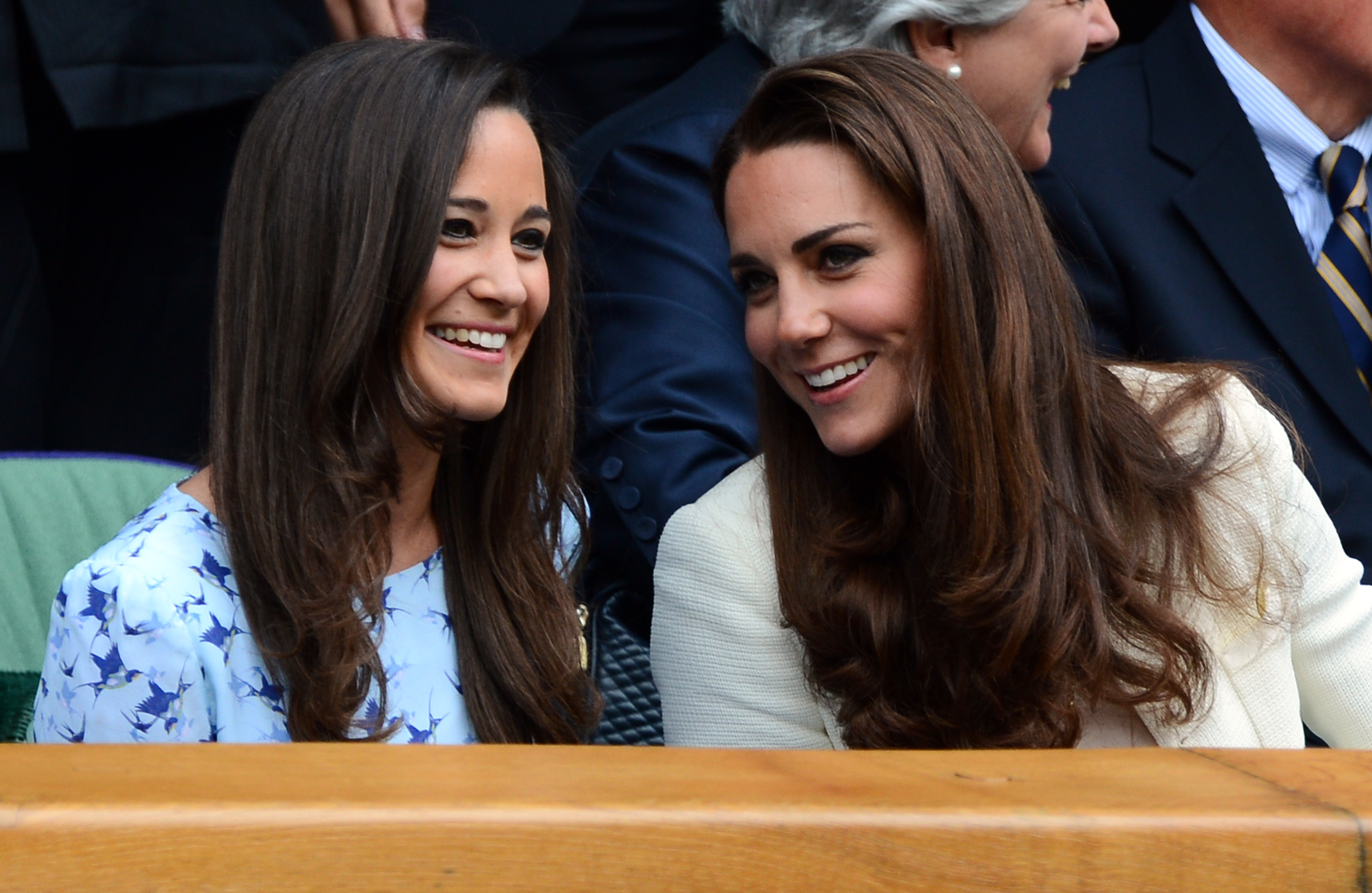 Catherine, Duchess of Cambridge (R) and