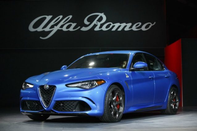 The Alfa Romeo Giulia vehicle is unveiled during Automobility LA ahead of the Los Angeles Auto Show in Los Angeles, California, U.S., on Wednesday, Nov. 16, 2016. Alfa Romeo revealed its first-ever SUV, the sleek Stelvio, while Jaguar introduced an electric I-Pace concept. Photographer: Patrick T. Fallon/Bloomberg