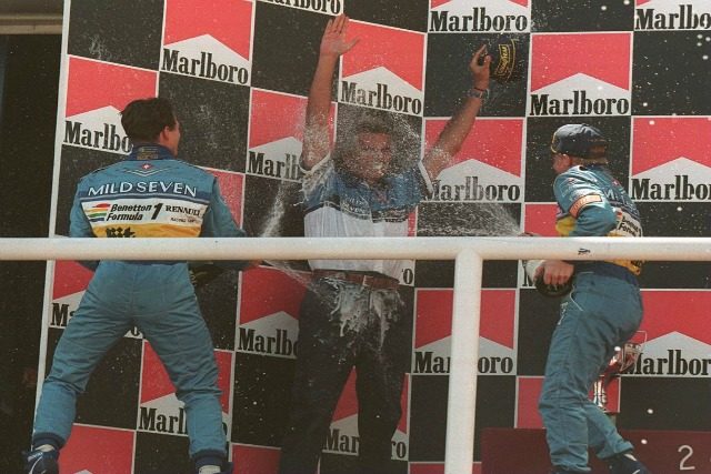 Podio con Briatore 1995