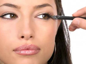 close up look of applying cosmetic pencil