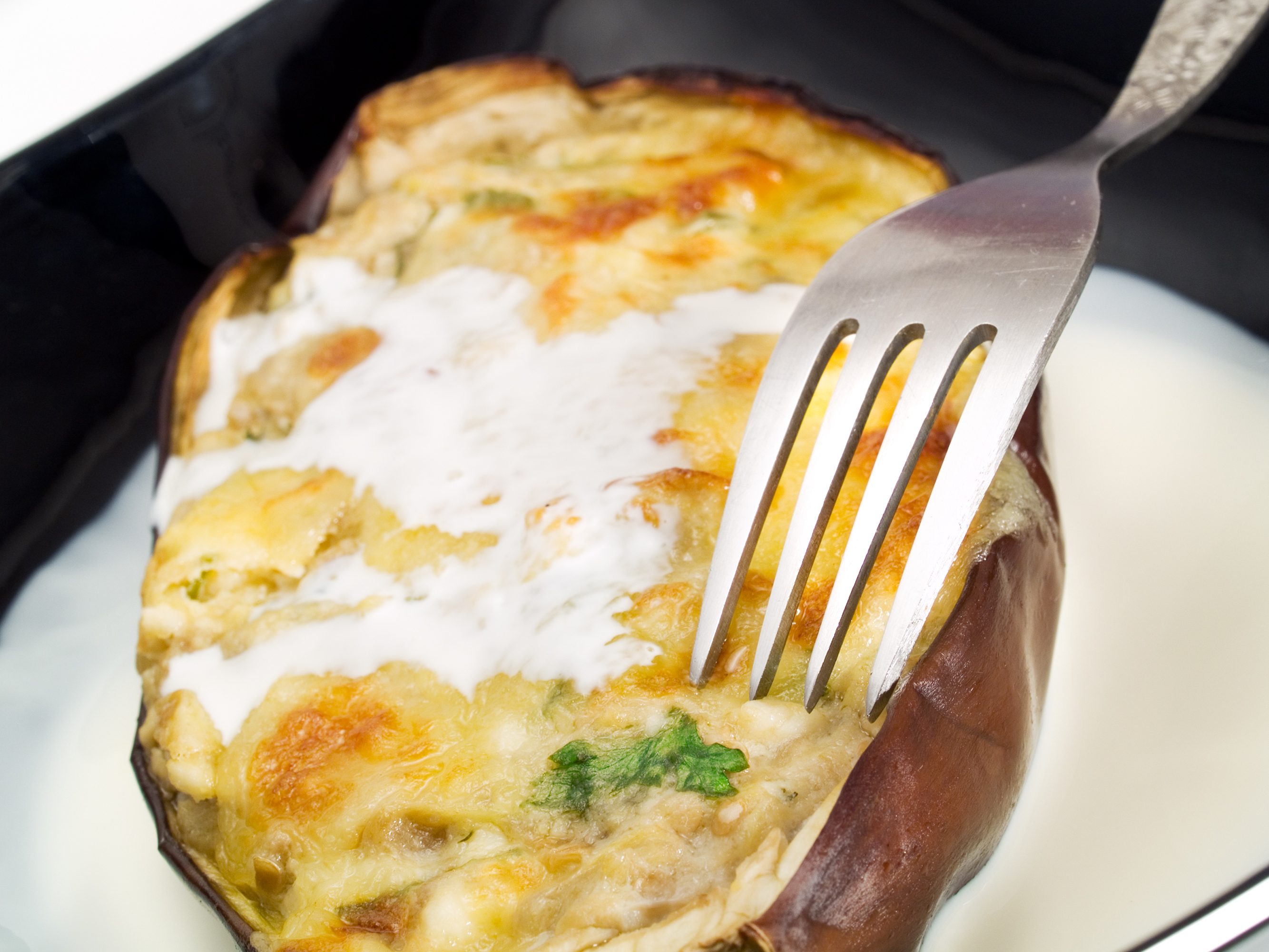 Melanzane ripiene di prosciutto e scamorza la ricetta facile e veloce