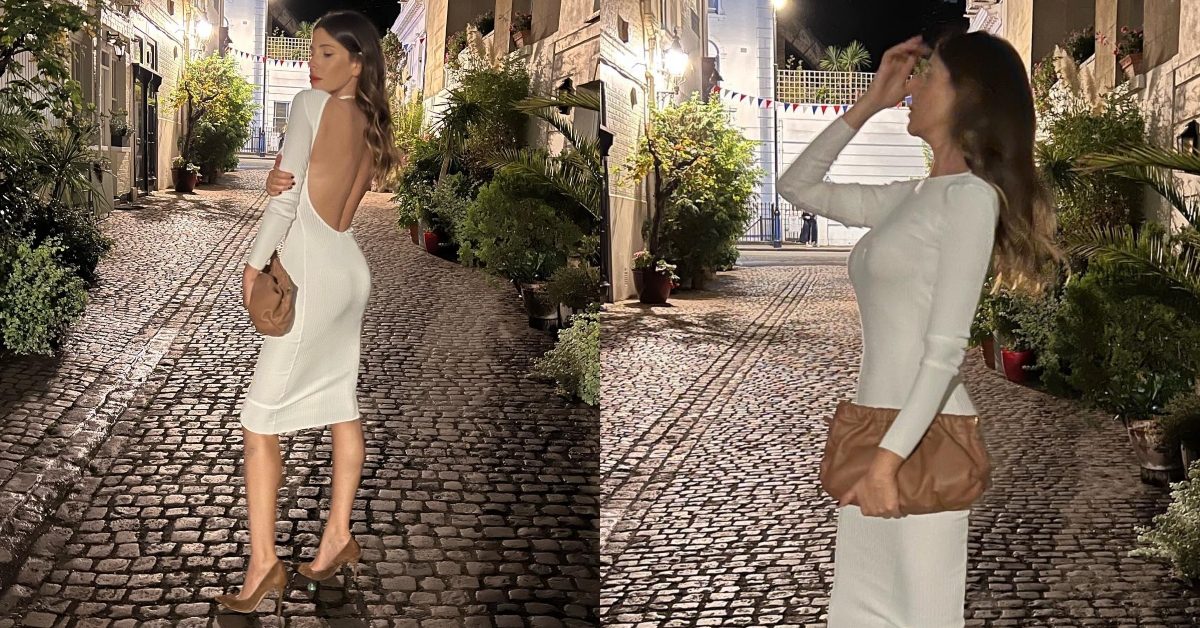 Alessia Marcuzzi in bianco con la schiena nuda per l'estate segue il